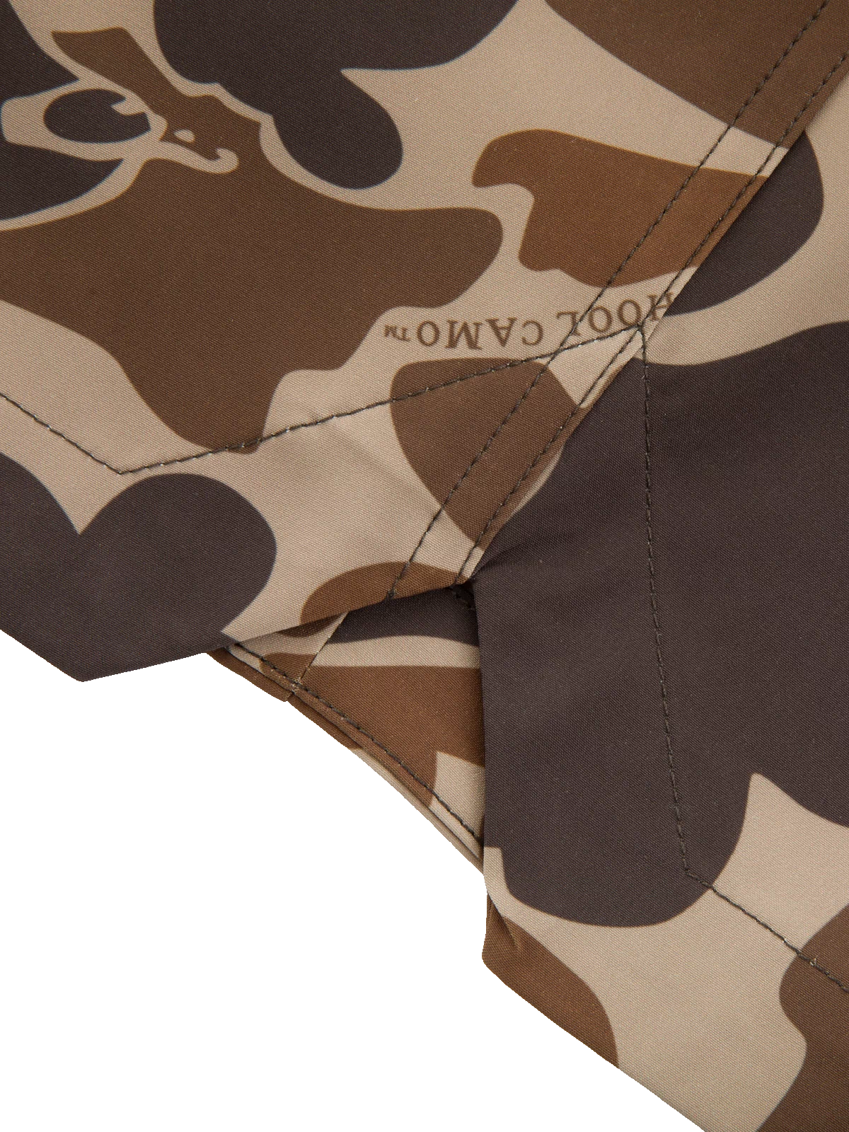 Close-up of Americana Lake Shore Dock Short's camouflage fabric, showcasing detailed stitching and CAMO™ print, highlighting its durable, water-repellent design suited for outdoor activities.