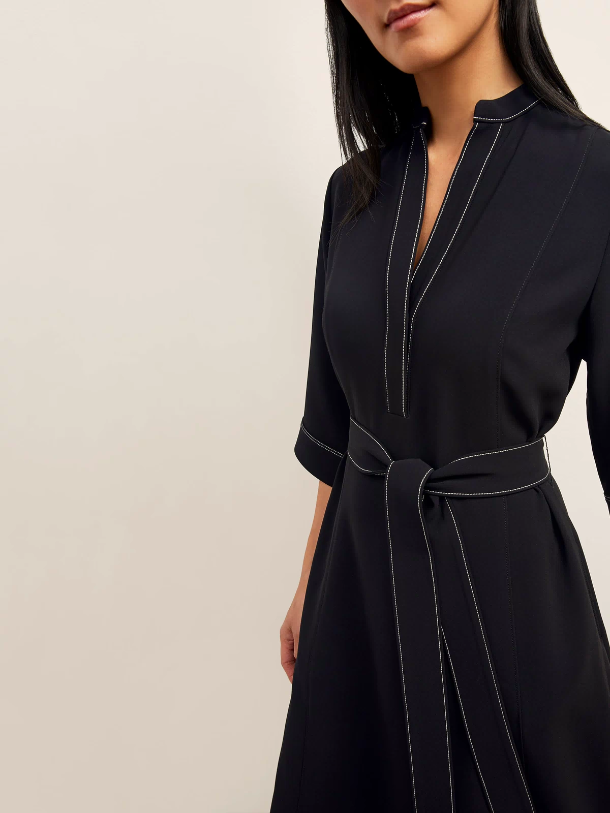 front image of a woman wearing the lauleh dress in black