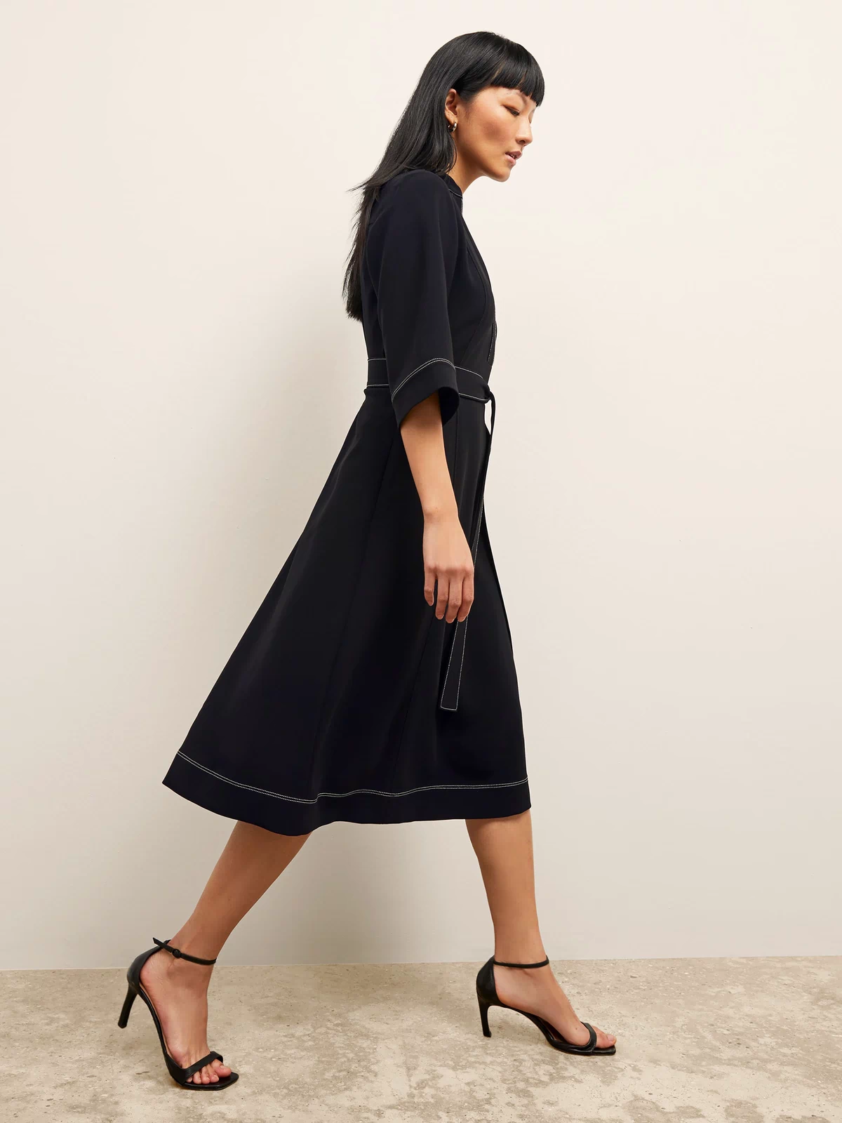 side image of a woman wearing the lauleh dress in black