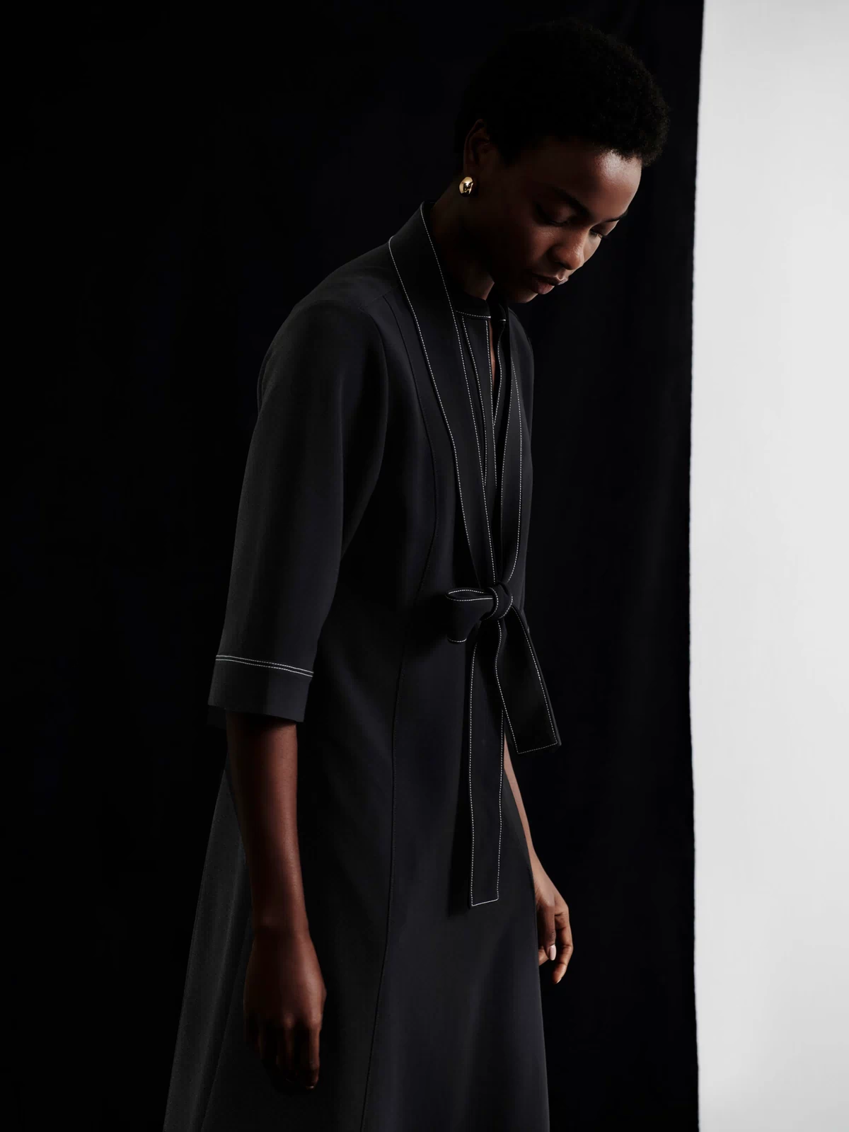 front image of a woman wearing the lauleh dress in black
