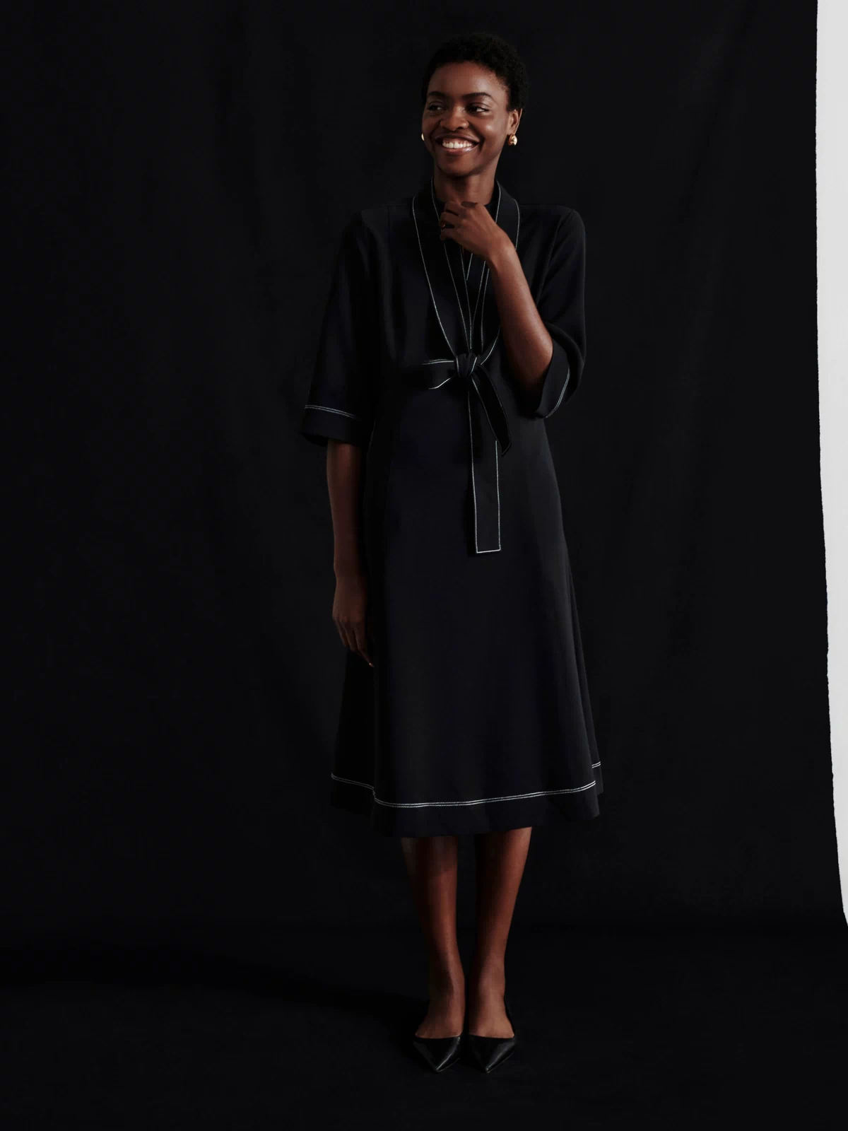 front image of a woman wearing the lauleh dress in black | Exclude