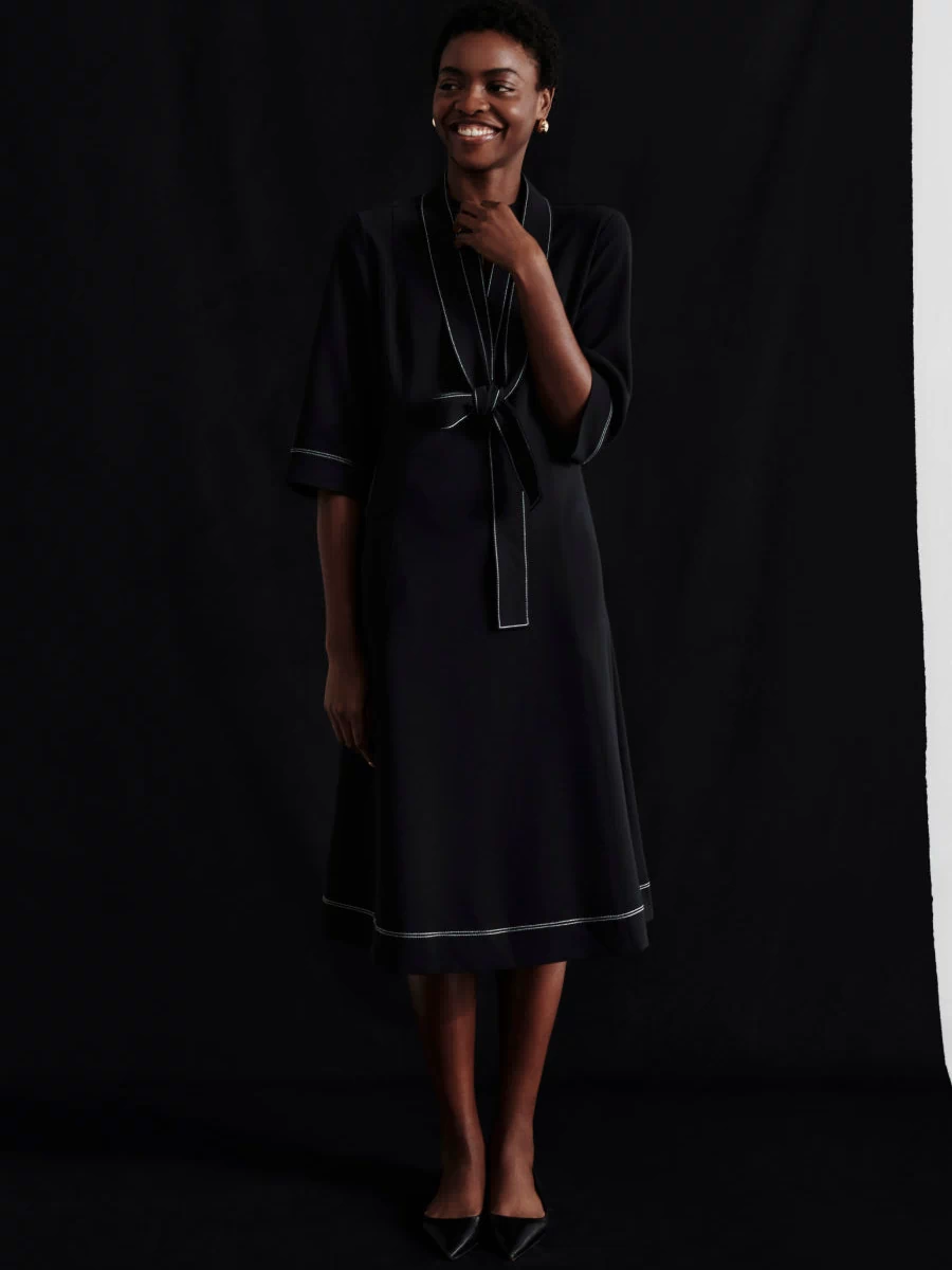 front image of a woman wearing the lauleh dress in black | Exclude