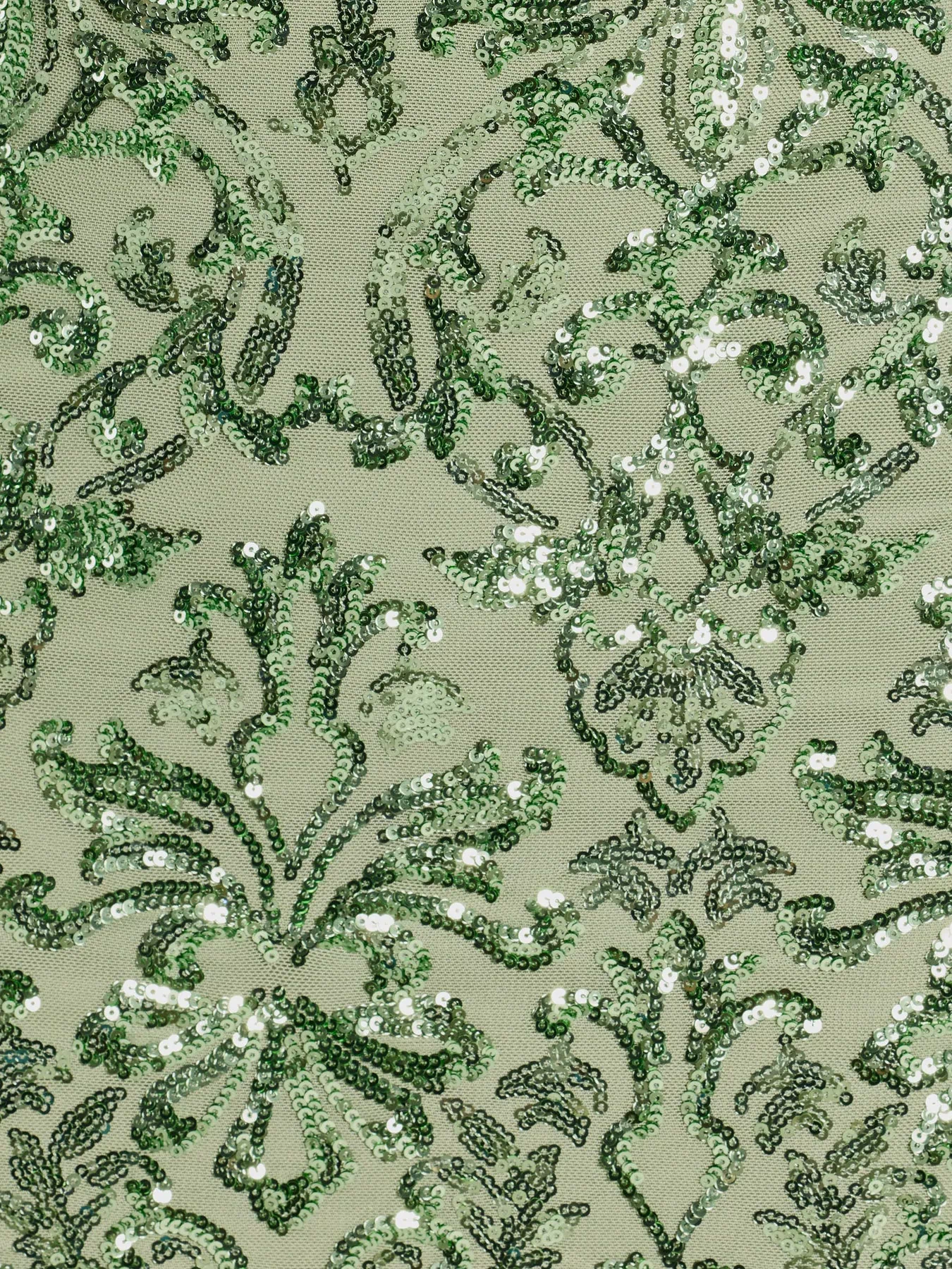 Own the evening in the Leila Sequin Bodycon Mini Dress in sage green, a cocktail dress perfect for rooftop parties and stylish soirées.