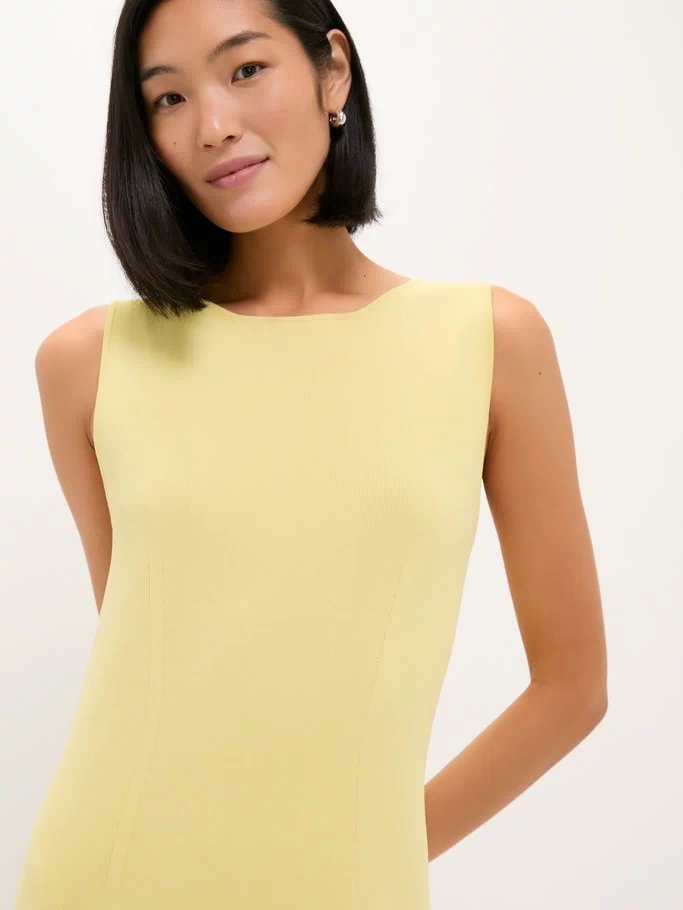 Young woman in a classic, sleeveless Lemongrass Kingston Knit Dress, showcasing an effortless, high-end style with a flattering, form-fitting silhouette, embodying fun and versatility.
