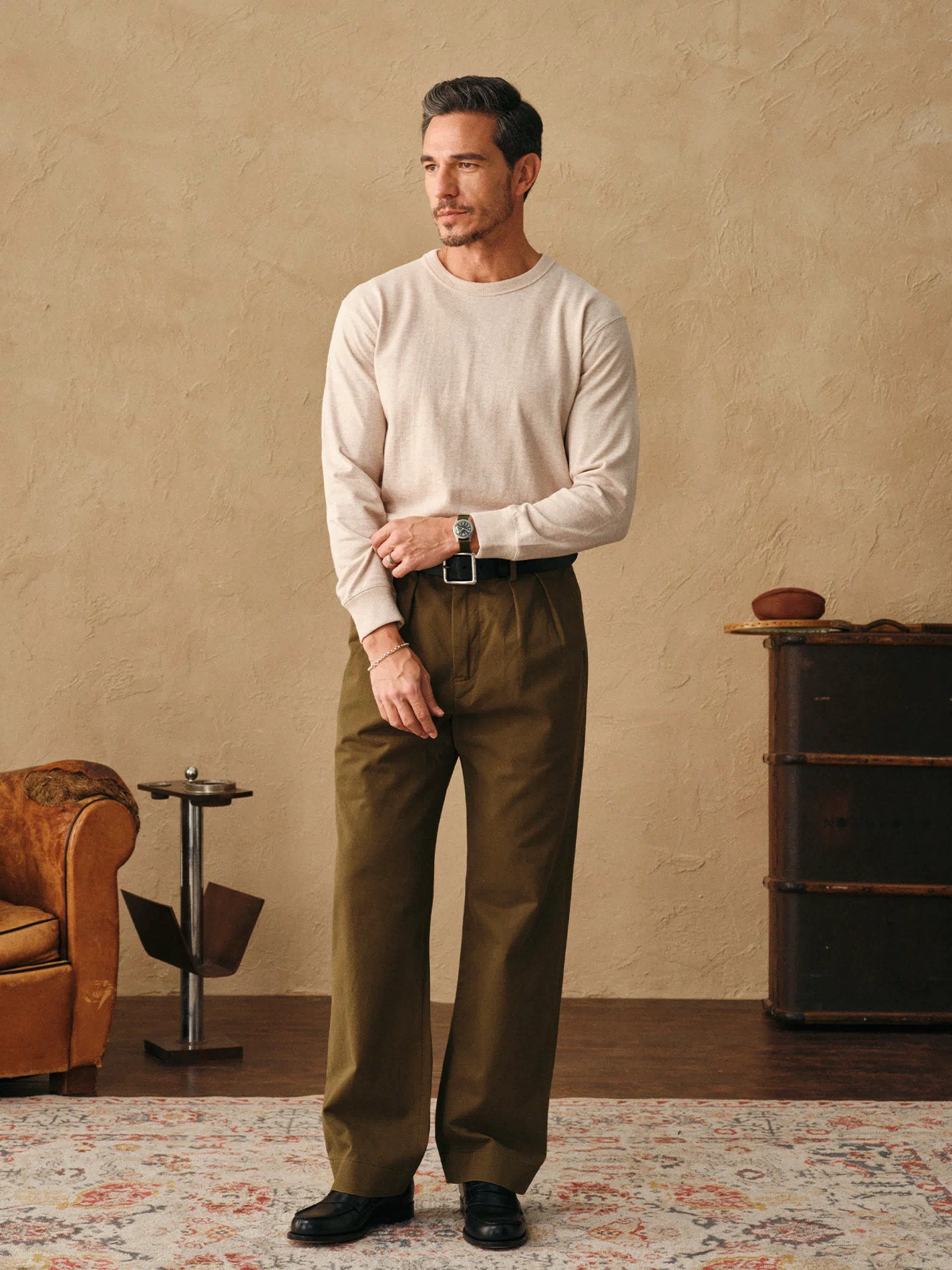 Oatmeal long-sleeve cotton t-shirt on model, crew neck and ribbed hem