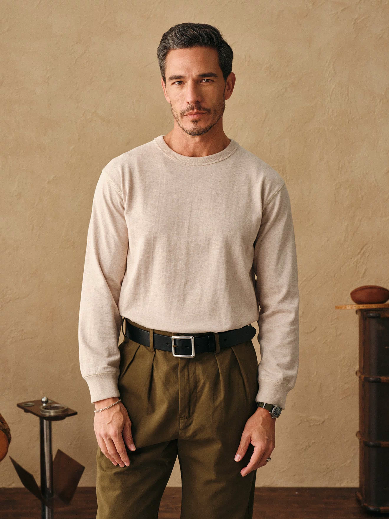 Oatmeal long-sleeve cotton t-shirt on model, crew neck close-up