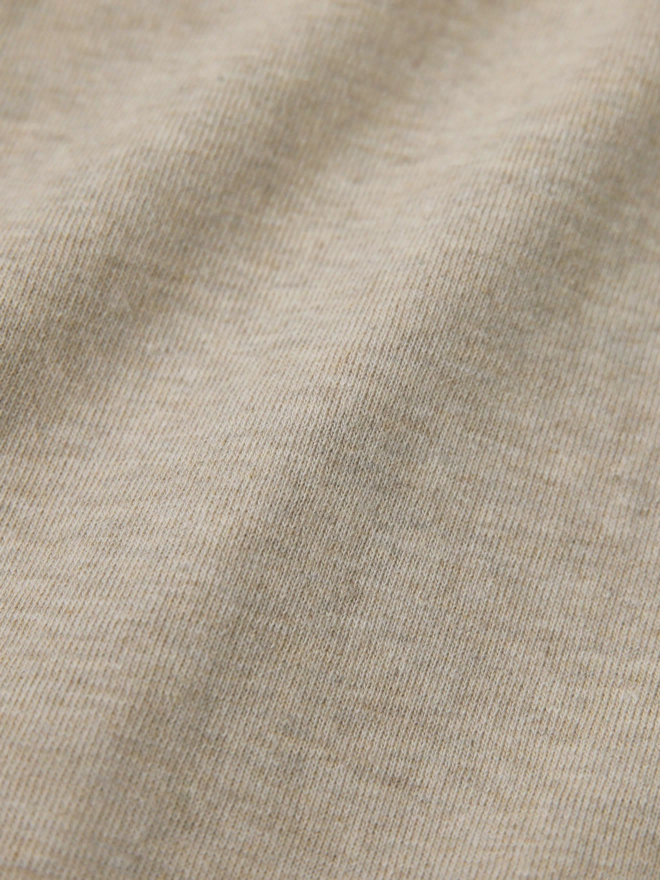 Oatmeal cotton t-shirt showing fine knit texture