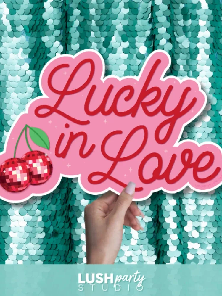 photo booth prop with 'Lucky in Love' text by Lush Party Studio 