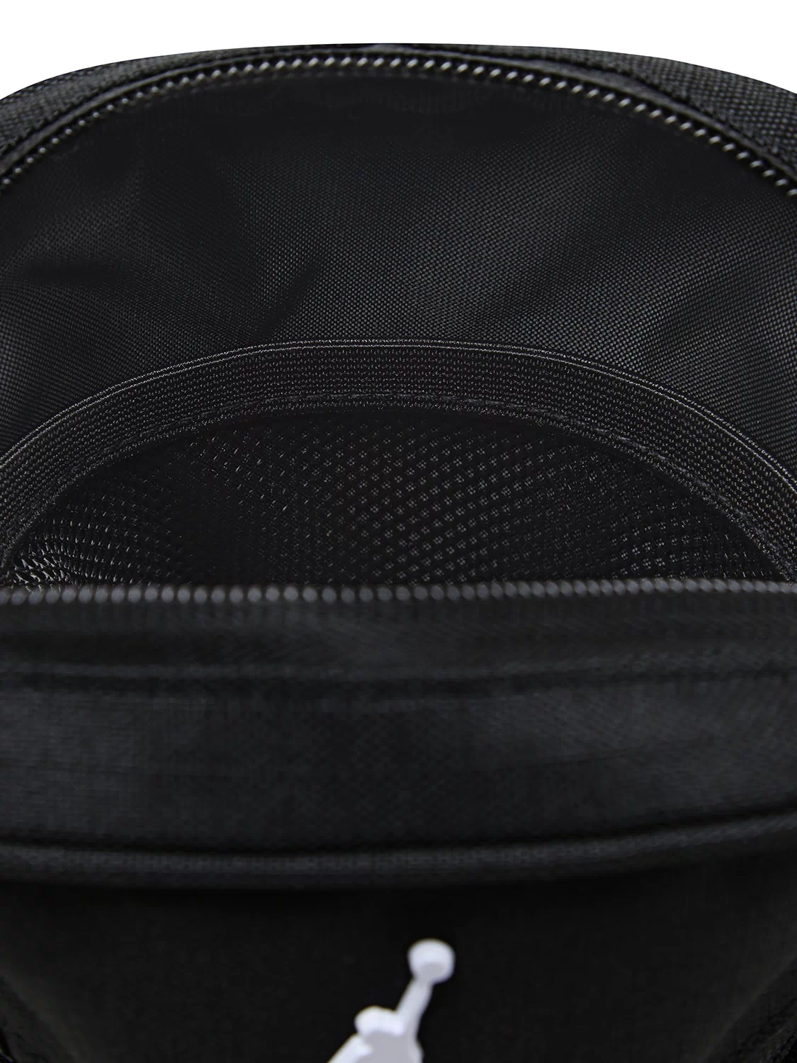 Blacktop festival bag close-up: black mesh front, zip trim, Jordan logo