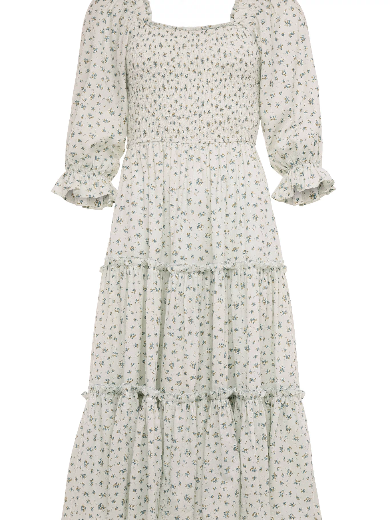 The Madeline Dress in Blue by Ivy City Co is a blue, long, tiered floral midi dress with a smocked bodice, three-quarter puff sleeves with ruffled cuffs, and a square neckline—an effortlessly maternity friendly style.