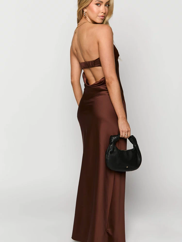 Rear view of a brown strapless satin maxi dress with a low cowl back and elasticated band across the upper back