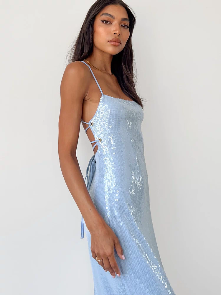 Side view of a light blue sequin maxi dress showing the criss-cross tie back and high side slit