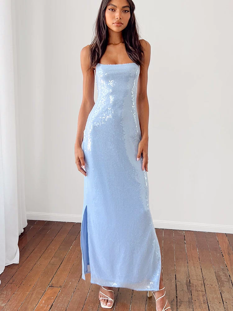 Close-up of the light blue mesh fabric with scattered sequins on the bodice of the slip dress showing a thin strap