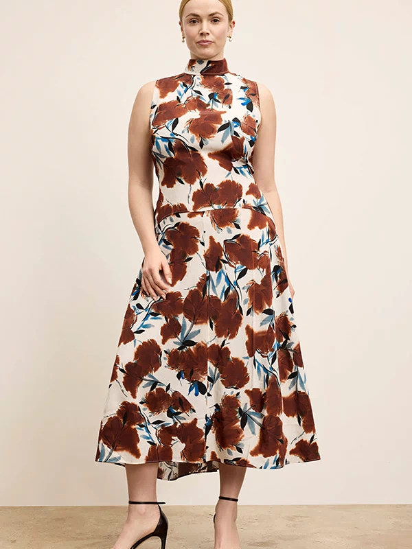 Woman wearing a floral dress with a neutral background | Exclude
