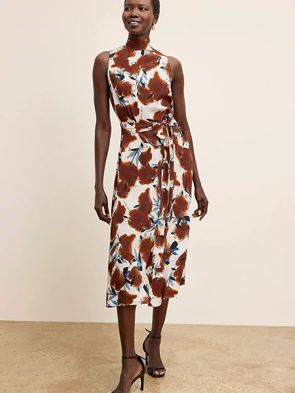 Woman wearing a floral dress with a plain background | Exclude | Grid