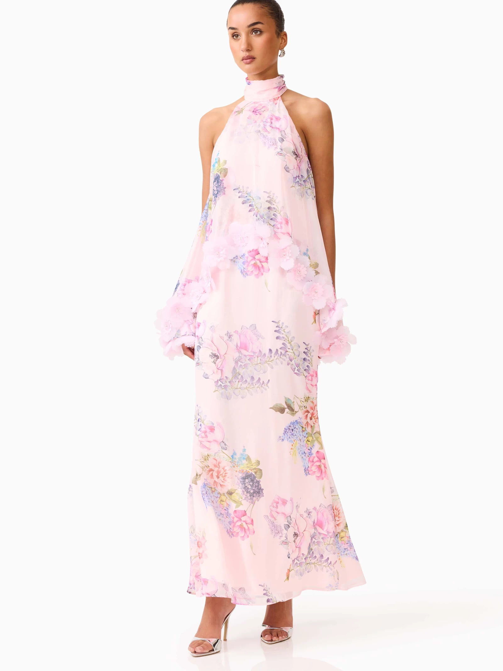 Brunette model wearing the Millie Tiered Gown in Pink Floral posed side shot 

