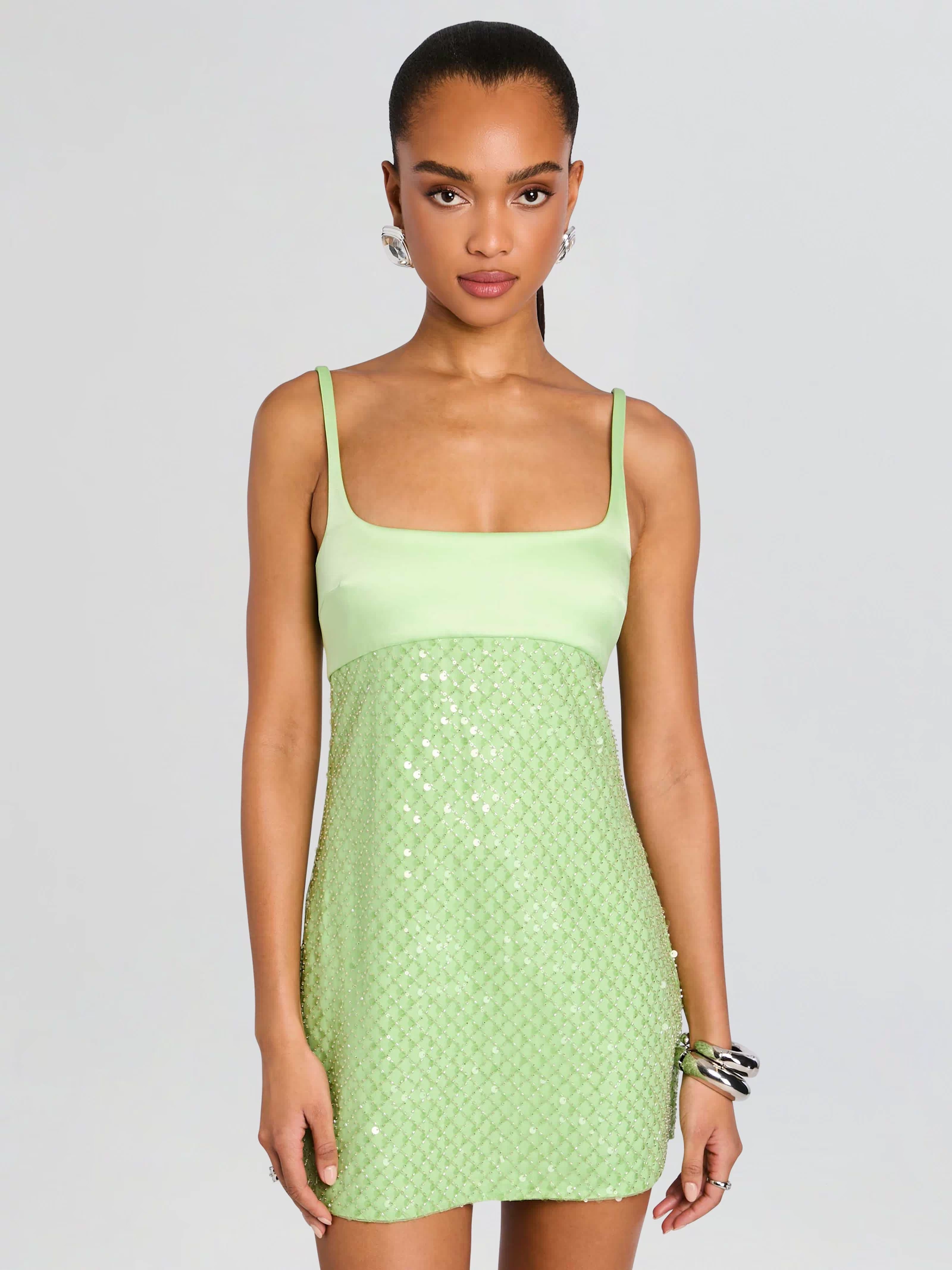 Front view of the mint green Monyca Sequin Dress featuring a satin bodice and sequin skirt