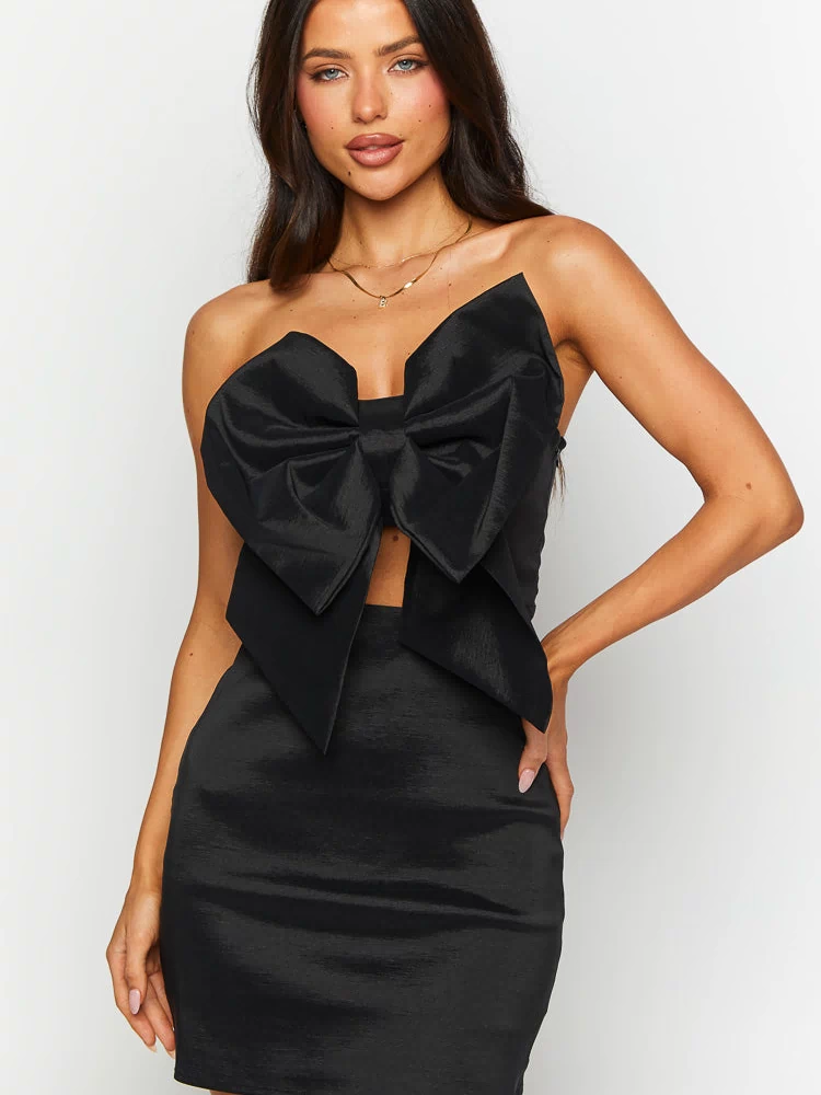 Beginning Boutique Nadia Black Bow Mini Dress black strapless mini dress with a large bow bust and a front cutout