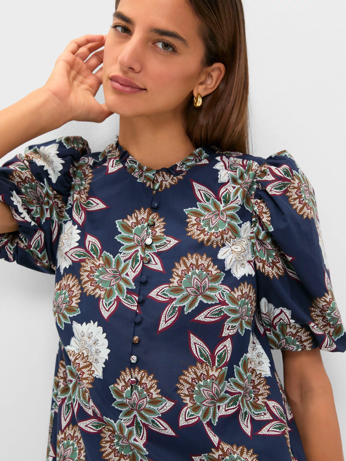 Navy Floral Mimi Mini Dress with classic puff sleeves and ruffle collar, epitomizing effortless, fun style with a high-end floral print and button details.