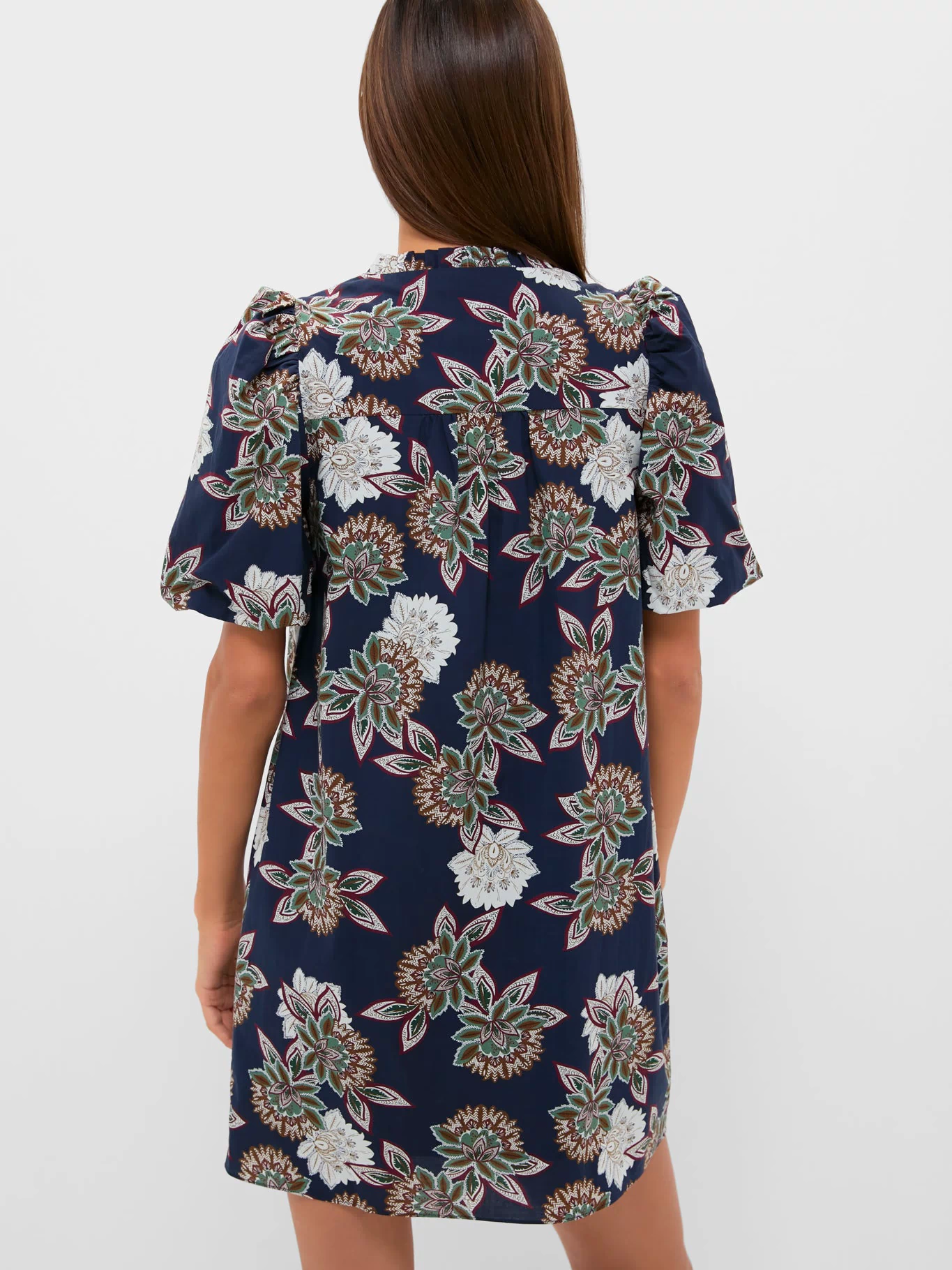 Navy Floral Mimi Mini Dress featuring classic puff sleeves and a gathered yoke, embodying effortless, high-end style with a fun, botanical pattern.