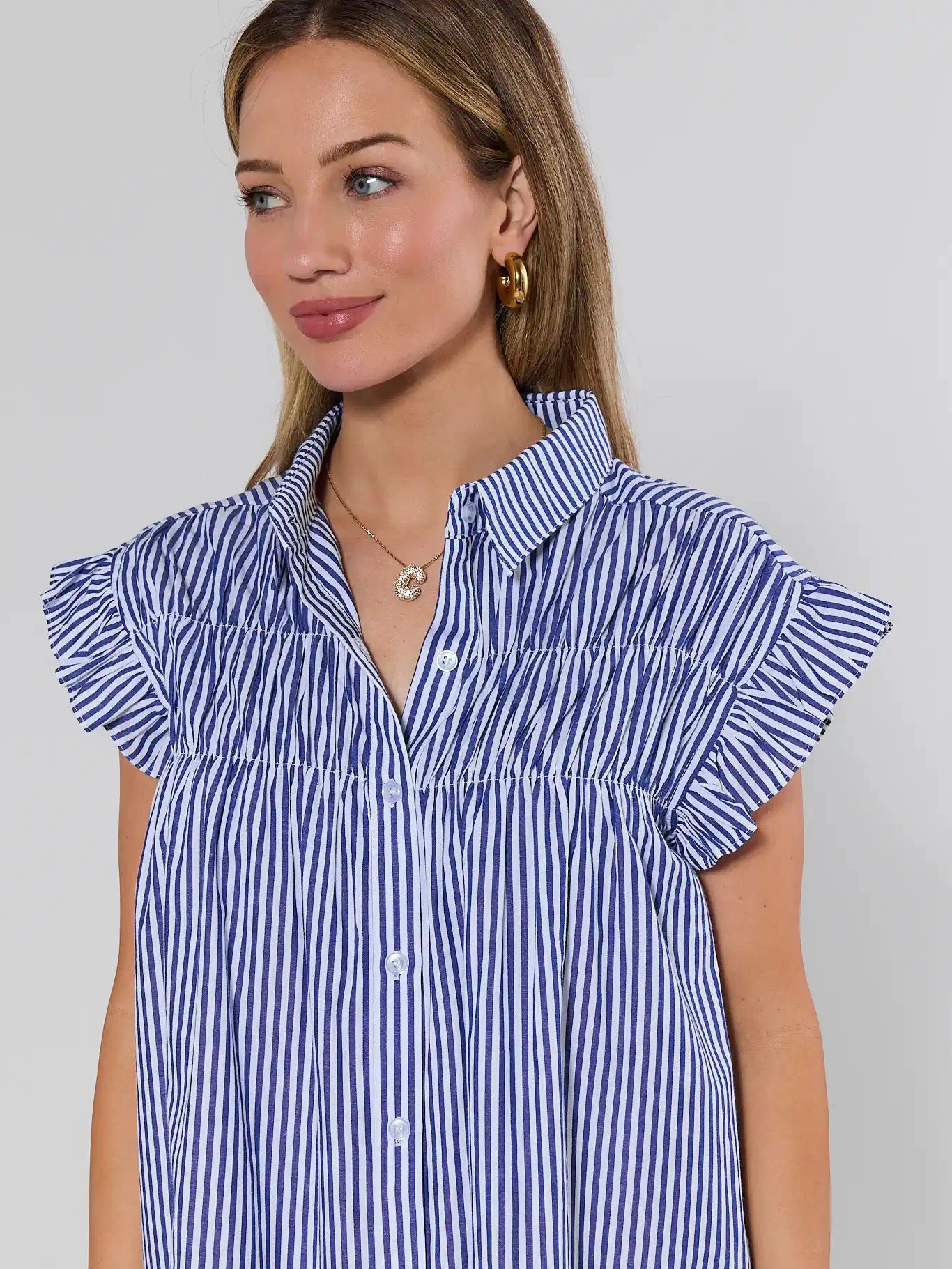 Navy stripe dress ruffle sleeve and collar close-up detail - On Model | Avara