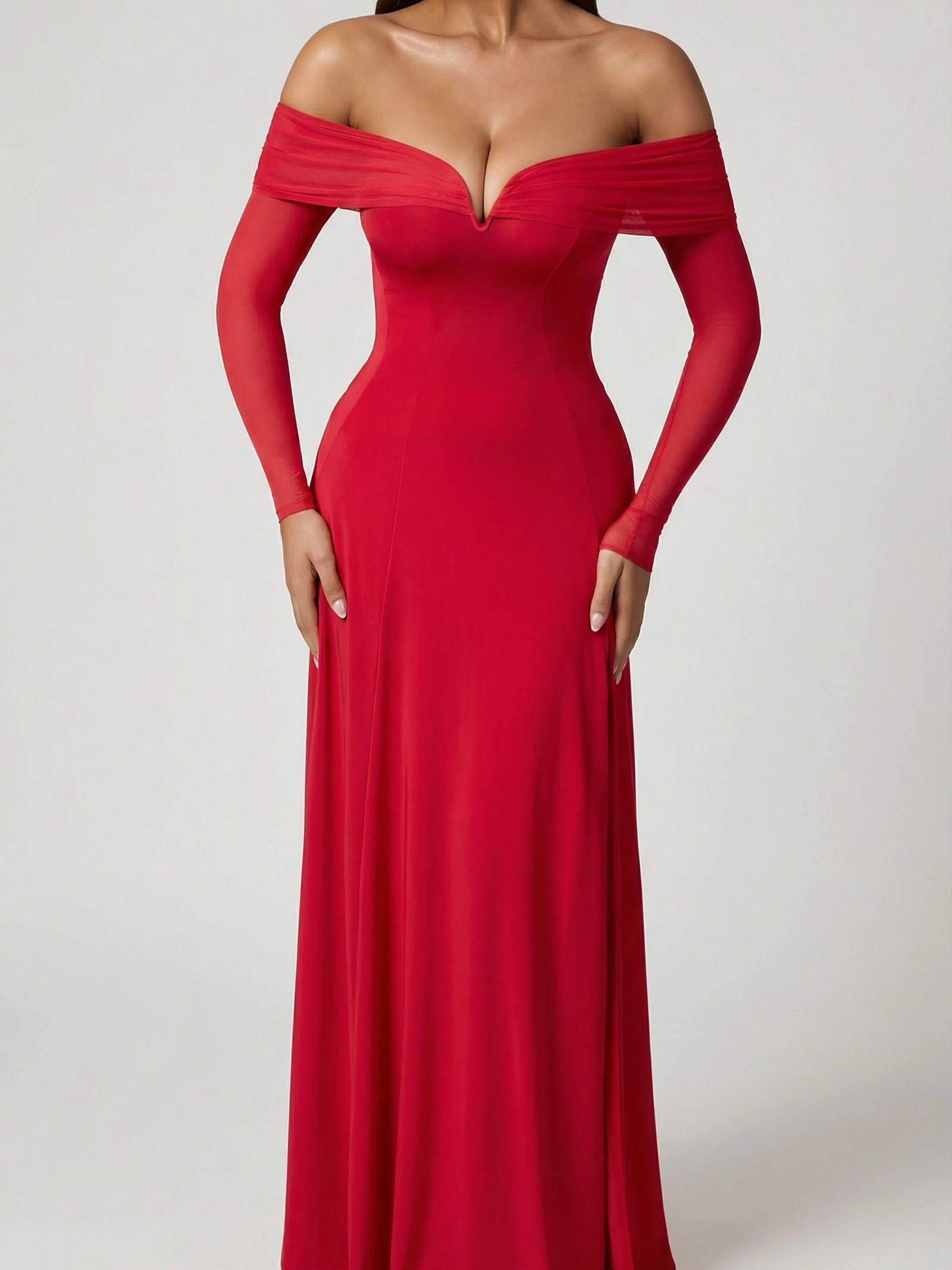 Oh Polly's Ella wearing the Nerissa Midaxi Dress in Red Sheer Jersey fabric perfect for holiday celebrations