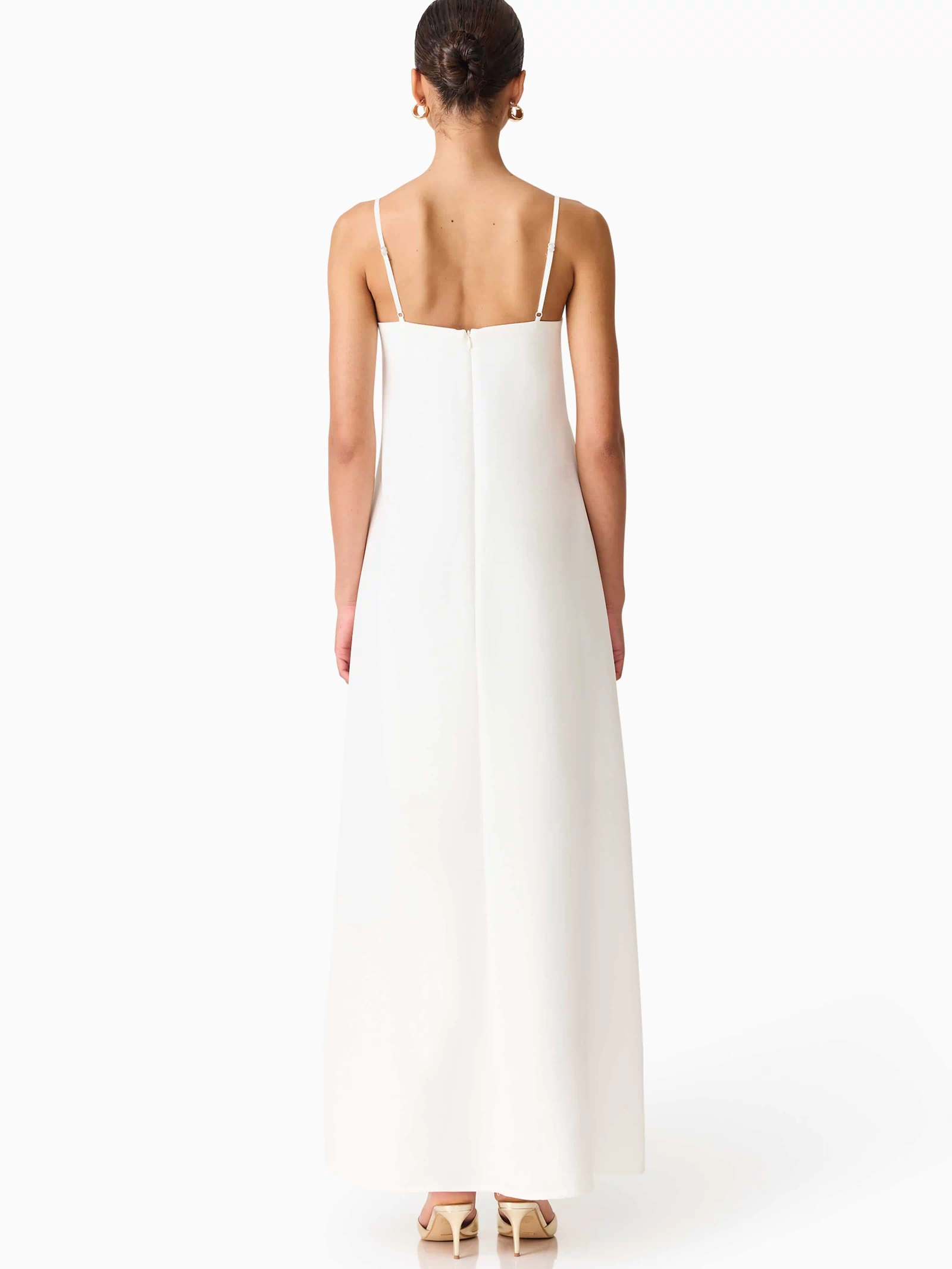 Brunette model wearing Nolana Floral Applique Gown in White back shot