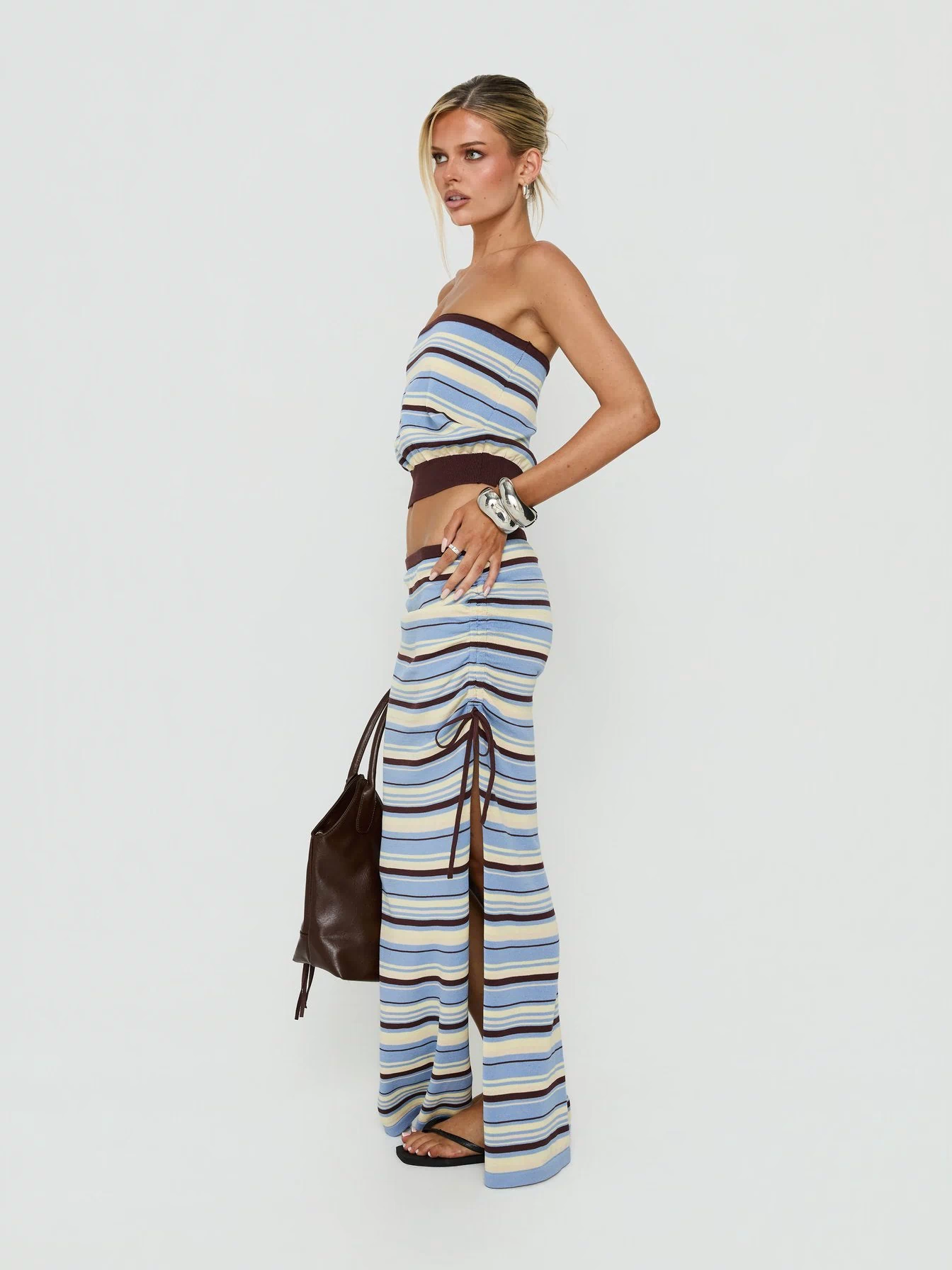 Crafted with the Osamie Knit Drawstring Maxi Skirt Multi Stripe in womens-skirts featuring ruched details and fitted silhouette side view of model wearing Princess Polly