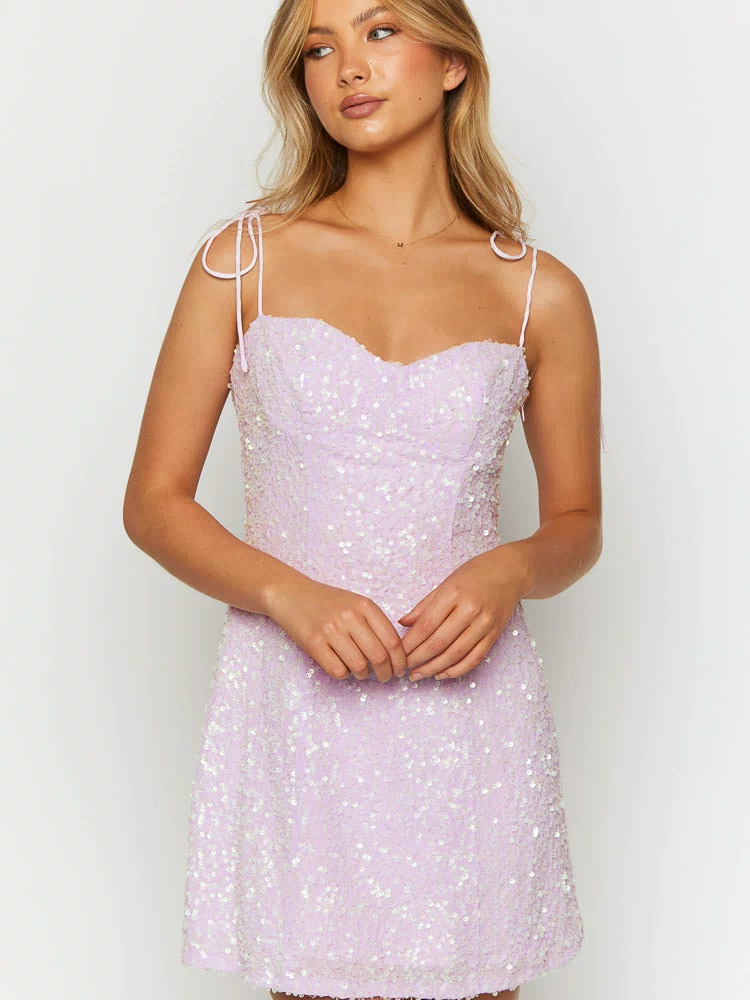 Front view of a purple sequin mini dress with a sweetheart neckline and delicate tie-up spaghetti straps