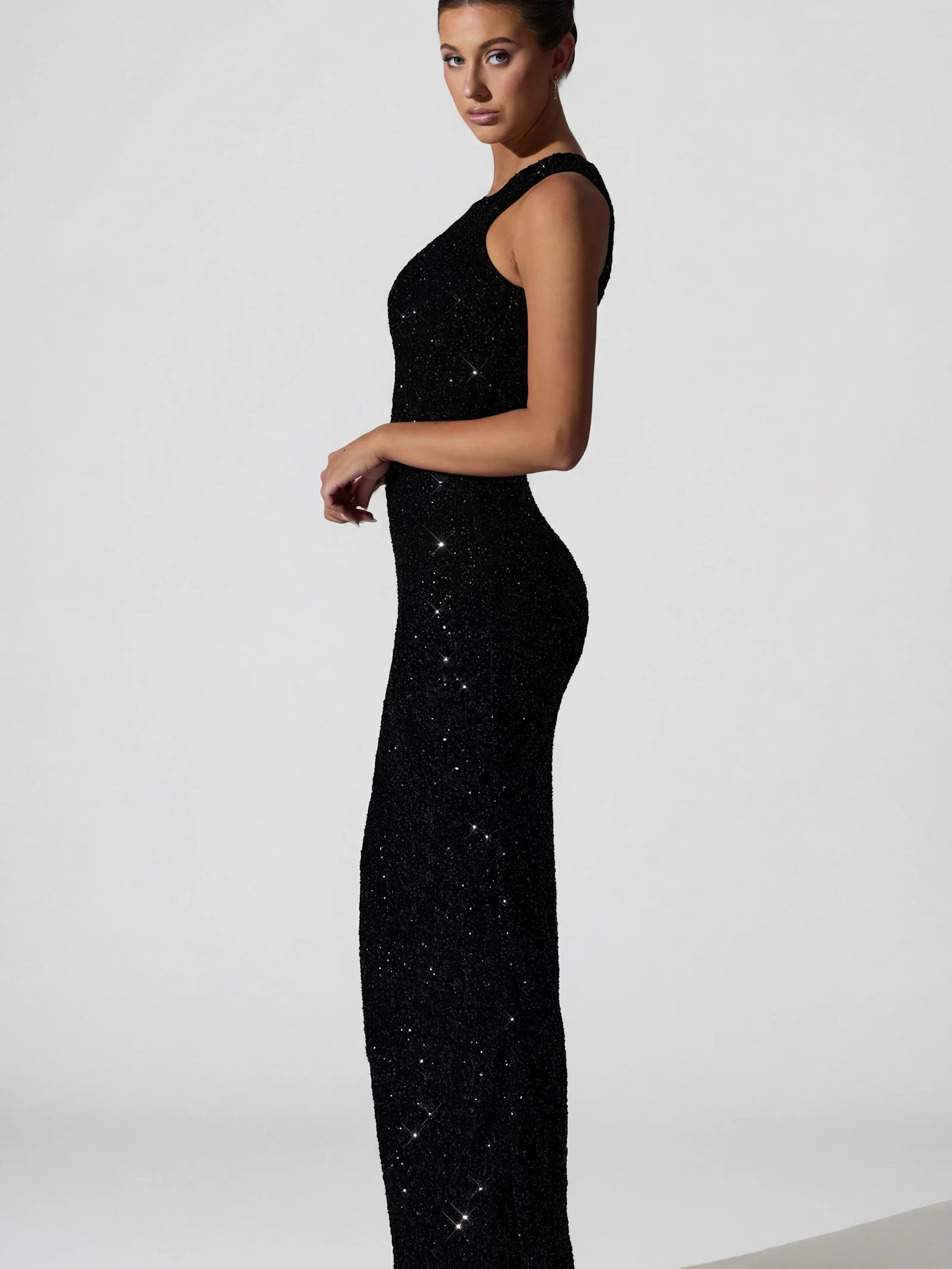Oh Polly's Anna wearing the Persephone Gown Length Dress in Black Micro Sequin fabric perfect for a special date night