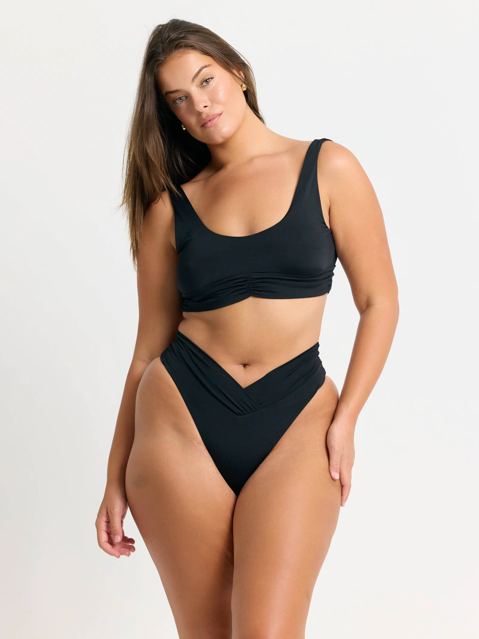 Black Pico high waist bikini bottoms by RIOT SWIM, featuring a stylish high-rise design and smooth fabric.