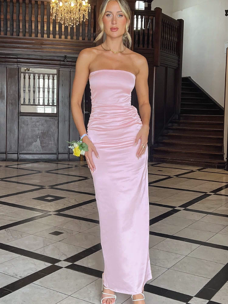 Full length front view of a pink satin strapless maxi dress with ruched detail on the left hip