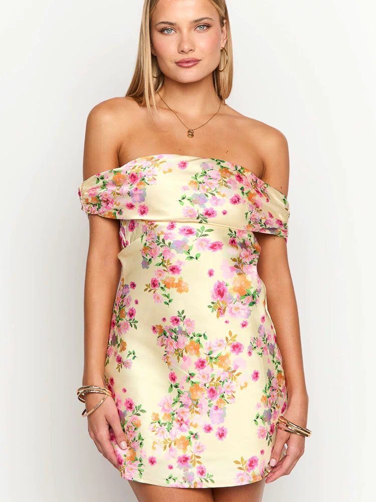 Primrose yellow off-the-shoulder mini dress with a ruffled neckline and vibrant pink and orange floral print