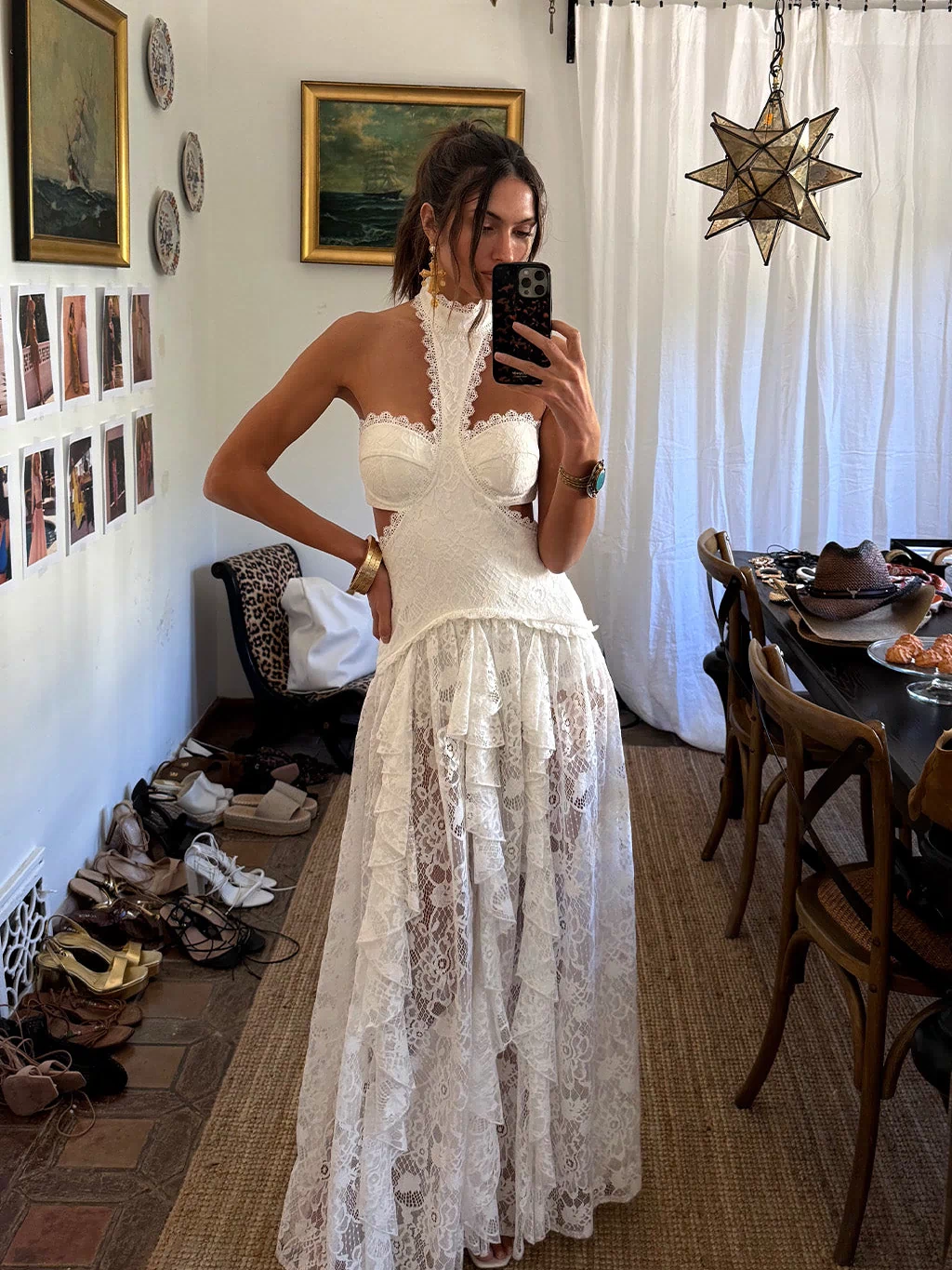 Back view of the white lace maxi dress showing the silhouette and fit.