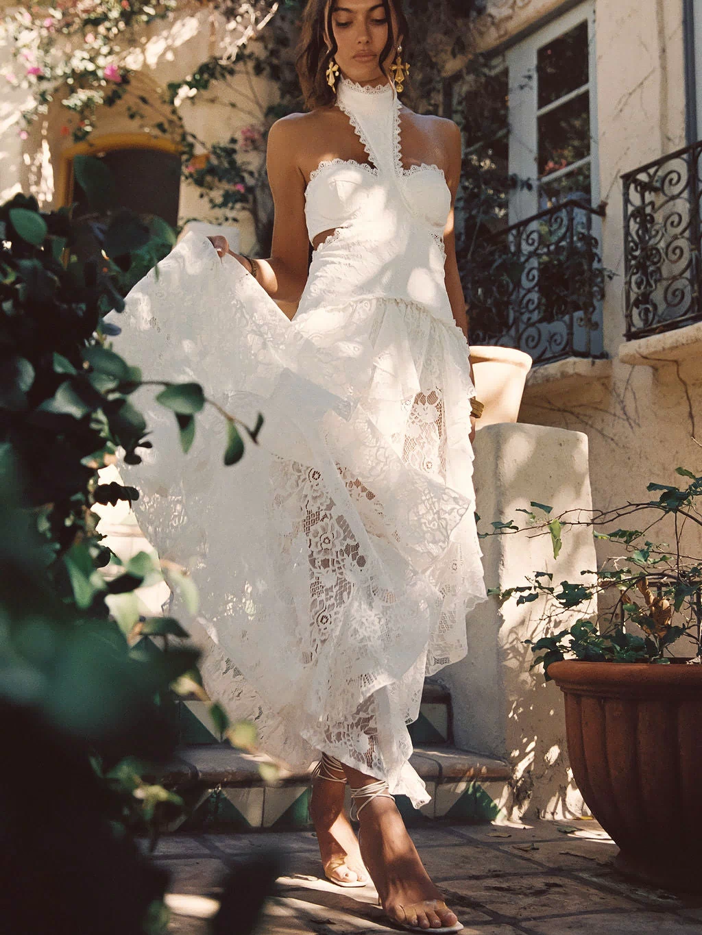 Lifestyle shot of the white maxi dress styled for day-to-night versatility.