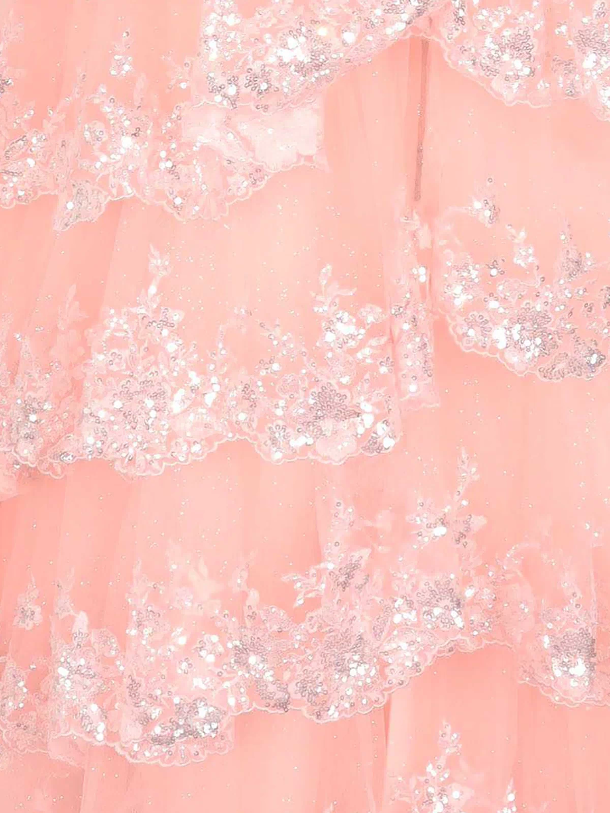 Close-up of the A-Line Corset Lace Prom Dress (PromGirl 250005), showcasing layered peach fabric with silver sequin floral embroidery and scalloped edges—an elegant choice for an off-the-shoulder prom look.