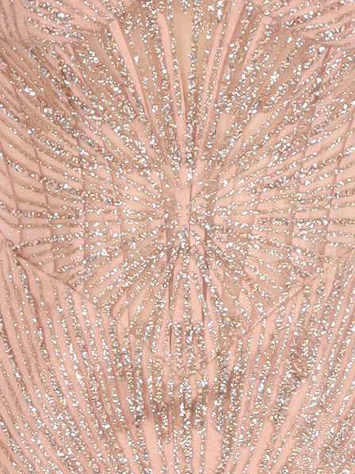 Close-up of a rose gold dress fabric with a starburst pattern.