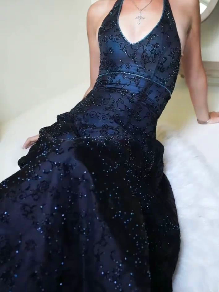 Close-up of purple lace detailing on halter prom dress bodice