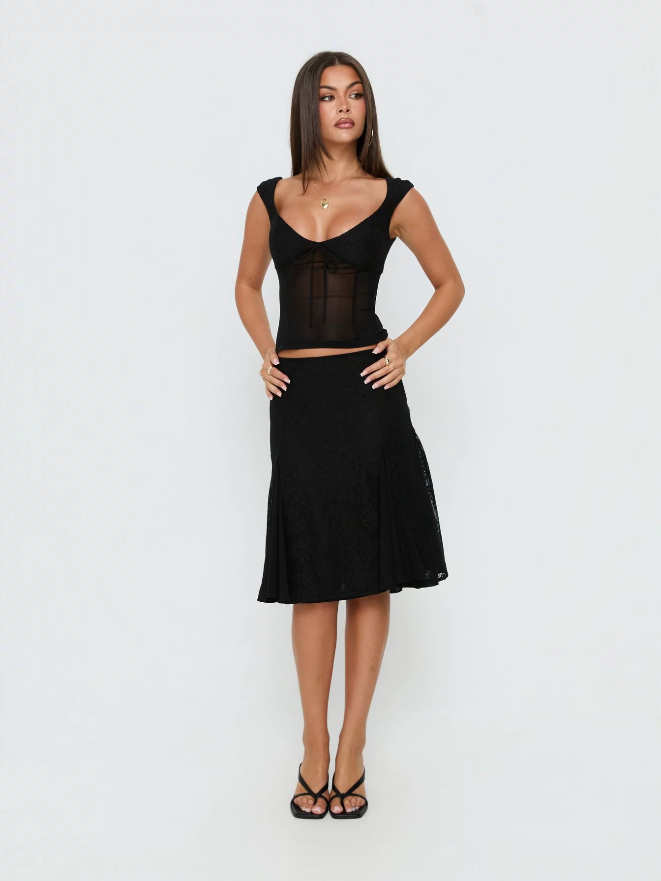 Showcasing the Quani Lace Midi Skirt Black womens-skirts in midi length front view of model wearing Princess Polly