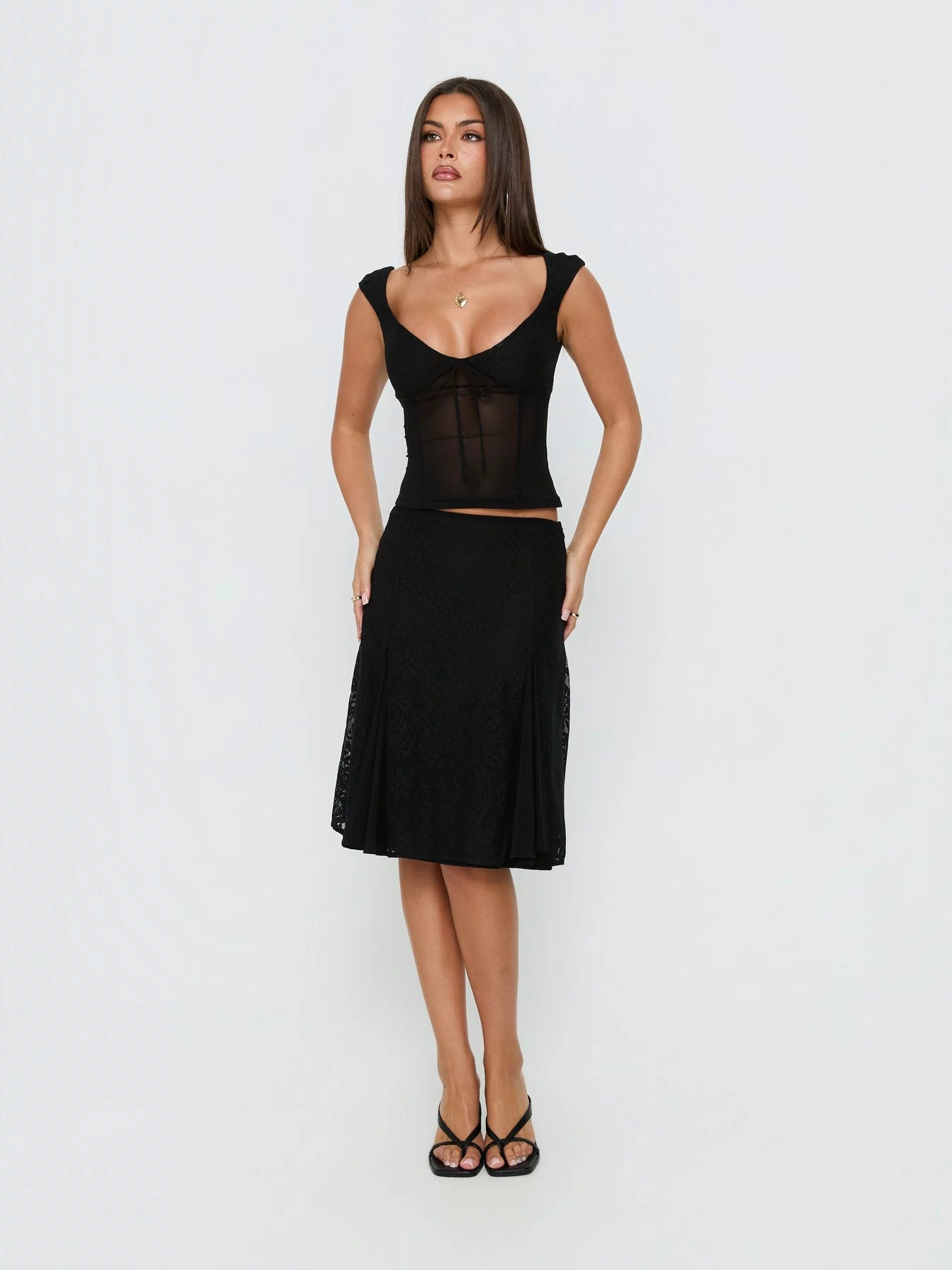 Showcasing the Quani Lace Midi Skirt Black womens-skirts in midi length front view of model wearing Princess Polly