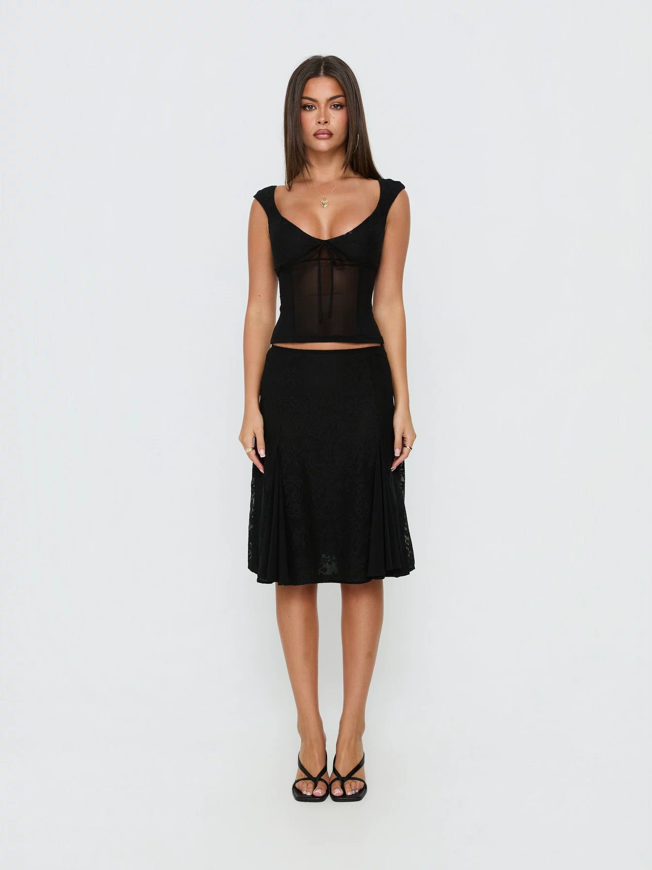 Showcasing the Quani Lace Midi Skirt Black womens-skirts in midi length front view of model wearing Princess Polly