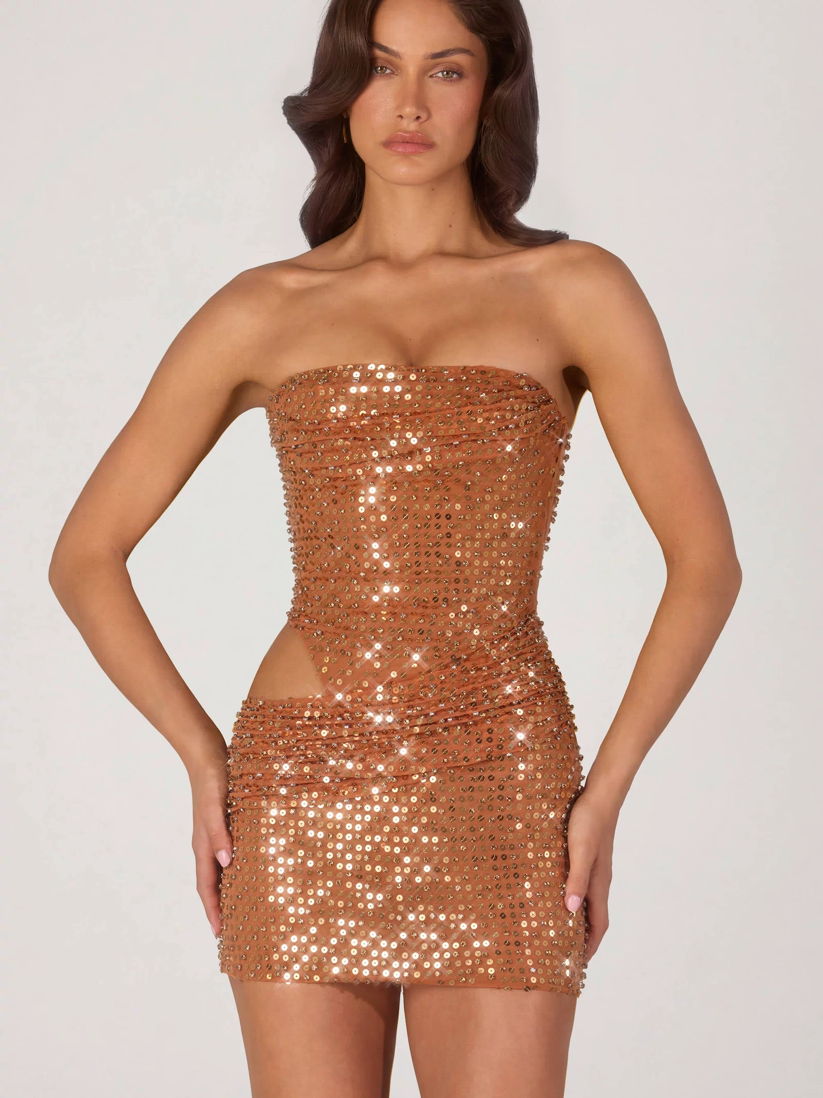 Oh Polly's Michelle Ivana wearing the Rania Mini Dress in Bronze fabric perfect for holiday gatherings