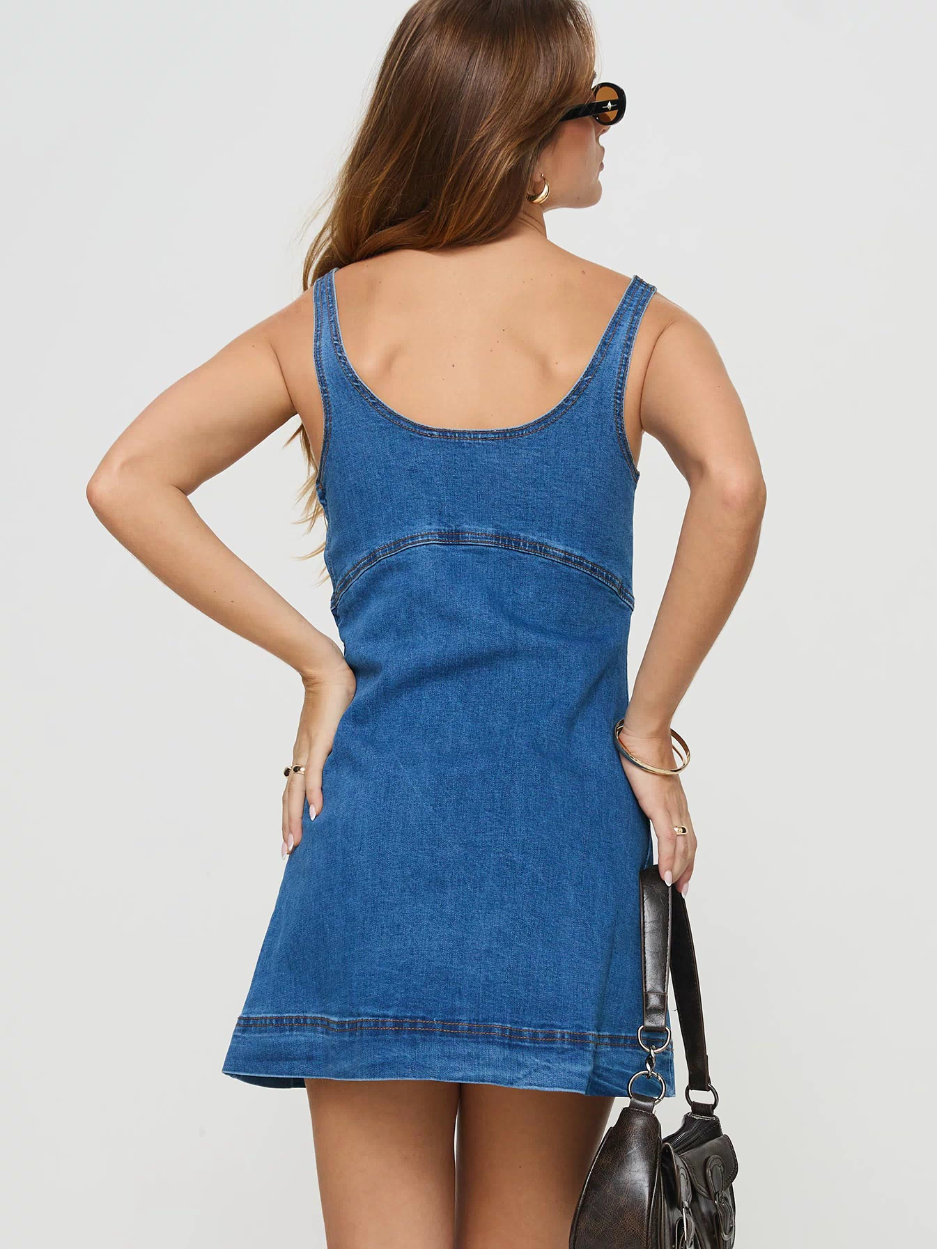 back view of model wearing Princess Polly Rautha Denim Mini Dress Mid Wash Scoop Neck 
