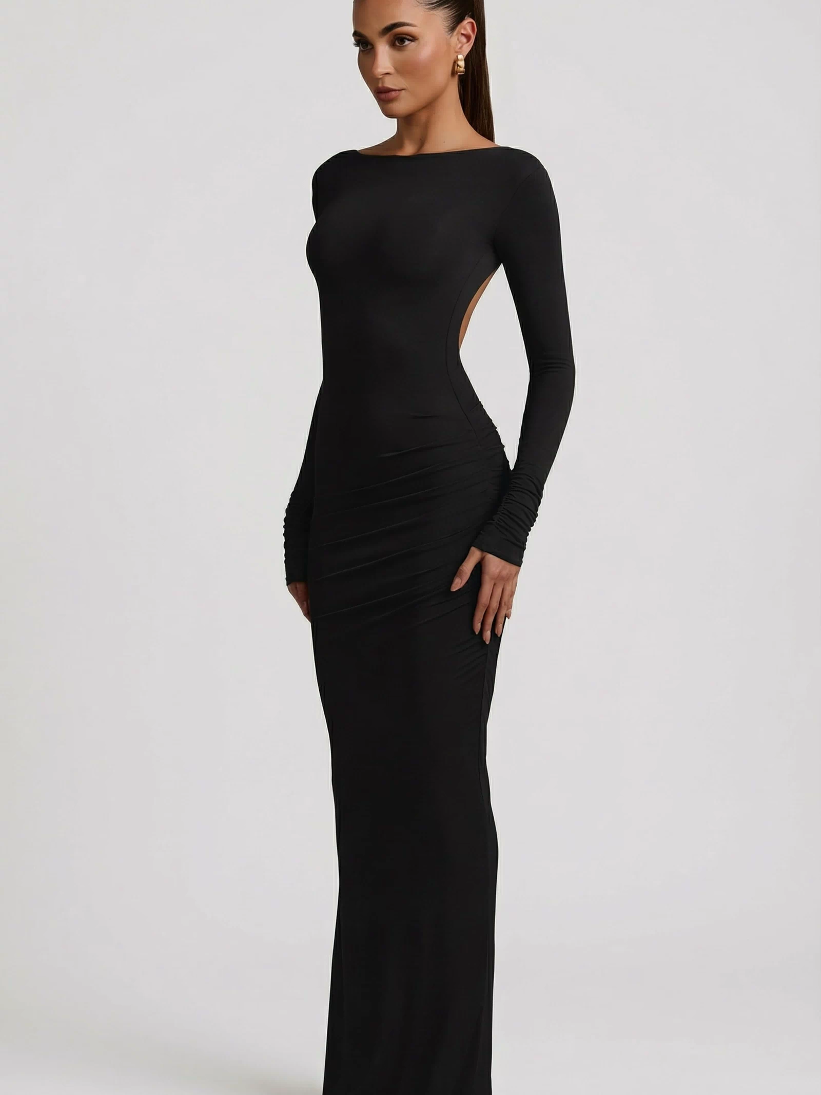 Oh Polly's Leidy wearing the Regine Maxi Dress in Black Modal fabric perfect for chic city evenings