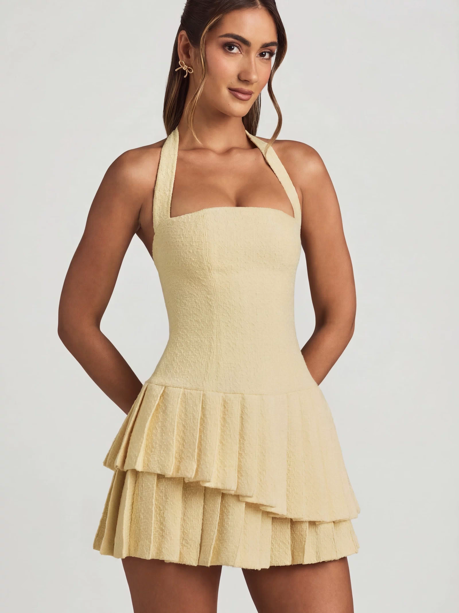 Oh Polly's Freya Tidy wearing the Rosaria Mini Dress in Pastel Yellow Tweed fabric perfect for daytime weddings