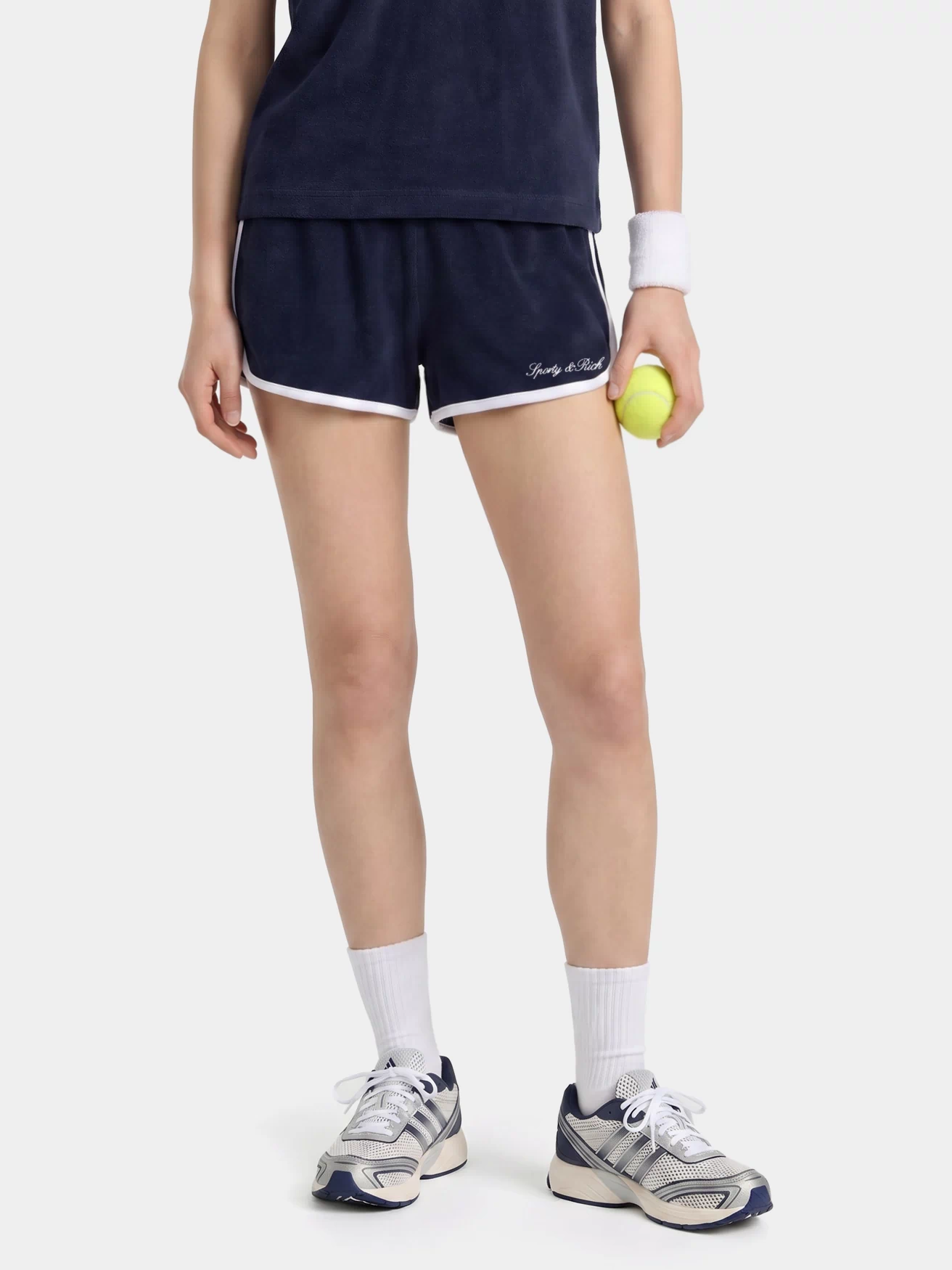 Navy shorts with white trim on a light gray background