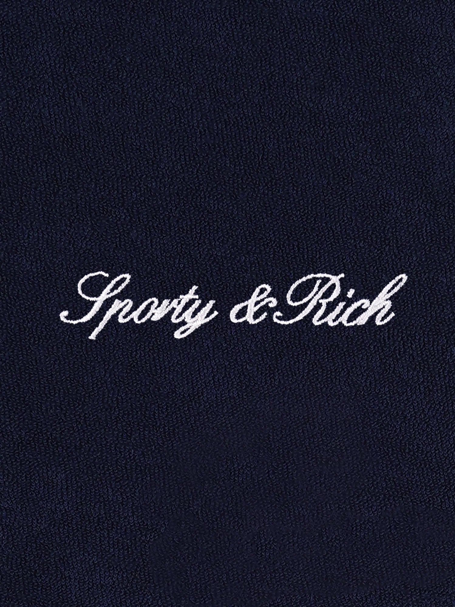 Navy shorts with white trim on a light gray background