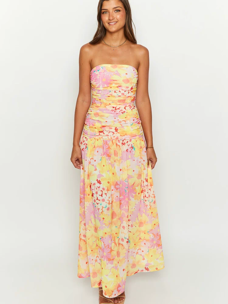 Vibrant yellow floral print strapless maxi dress with a ruched bandeau bodice and a flowing skirt