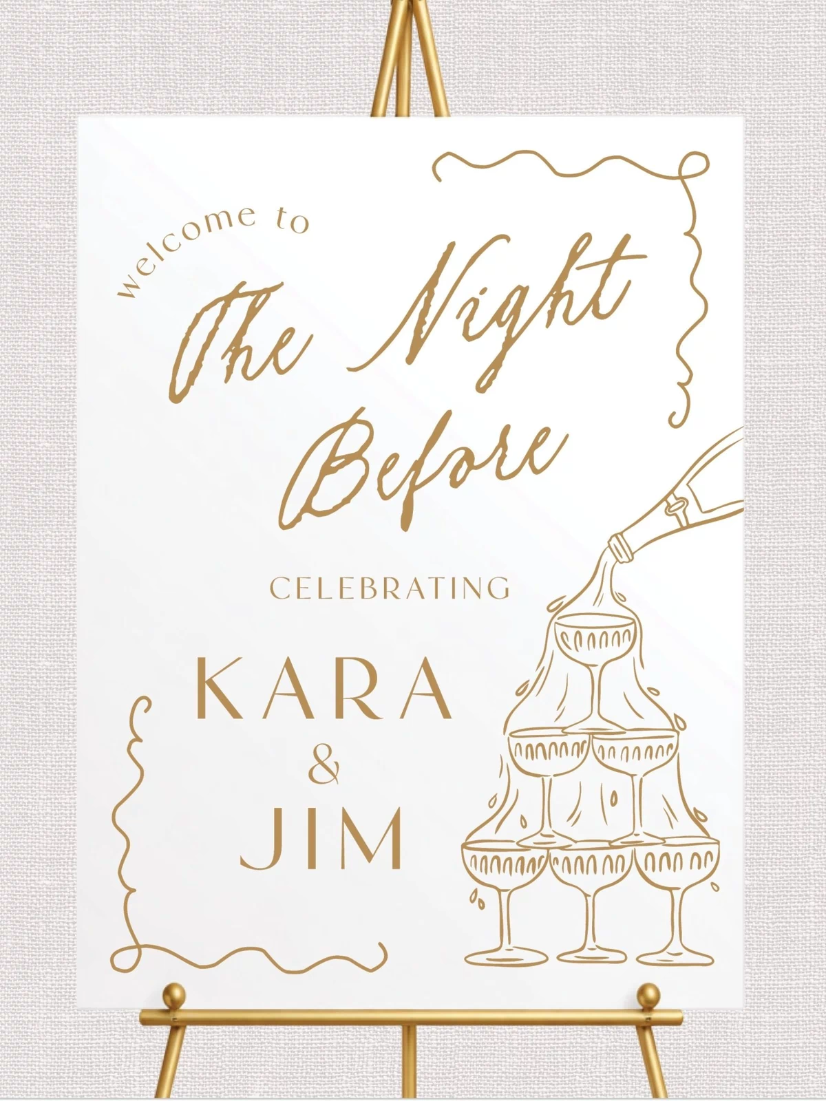 White welcome sign with gold champagne tower and script text design for rehearsal dinner
