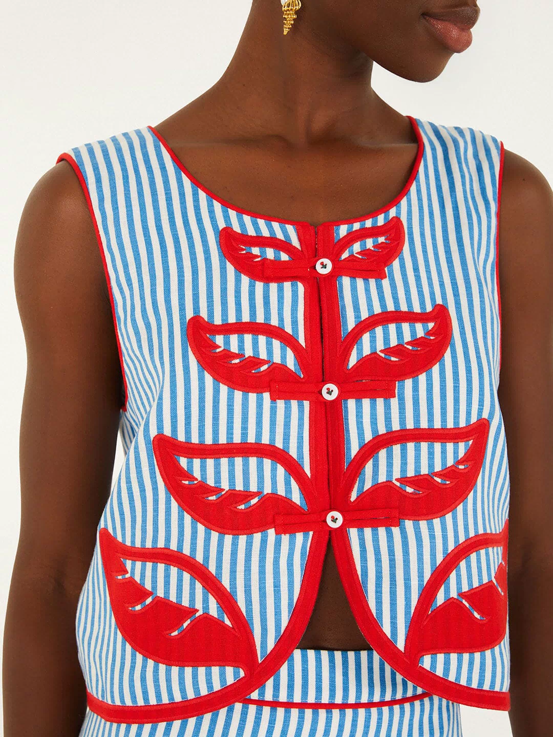 FARM Rio model wearing the Sky Stripes Blue Sleeveless Crop Top